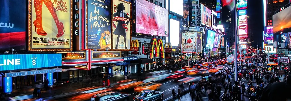 people walking on street during night time